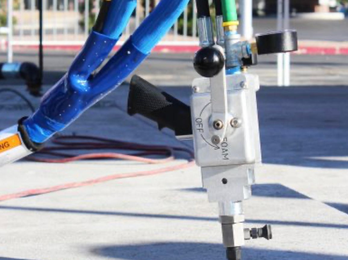 Foam injection gun on concrete slab — Magic Raising equipment photo